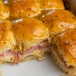 Close up of ham and cheese sliders to show off the melted cheese in a Crock-Pot.