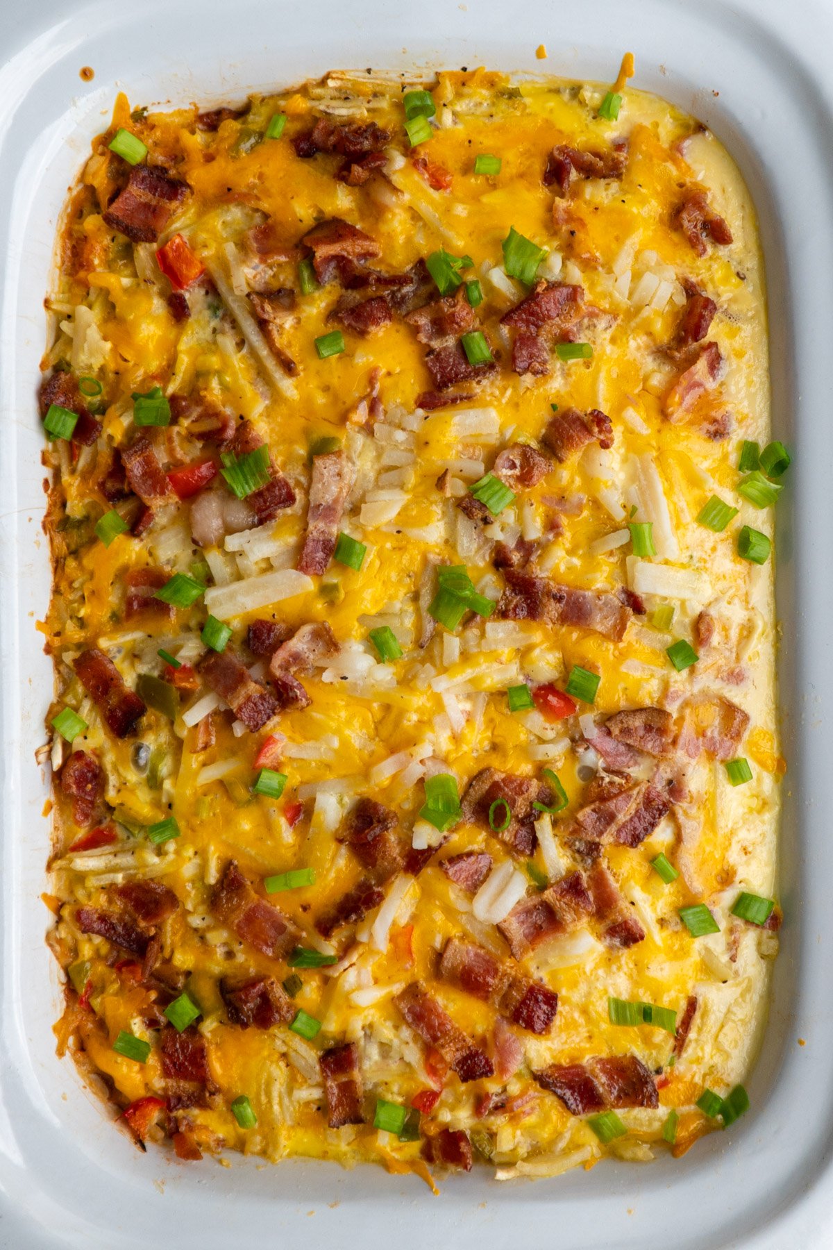 Overhead look at Crockpot breakfast casserole in a white dish.