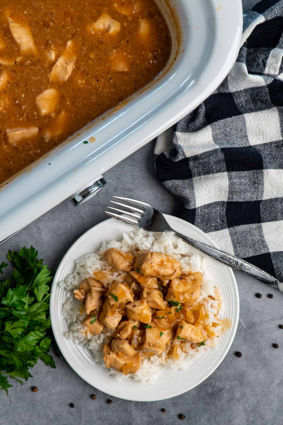 Over head look at slow cooker bourbon chicken over white rice.