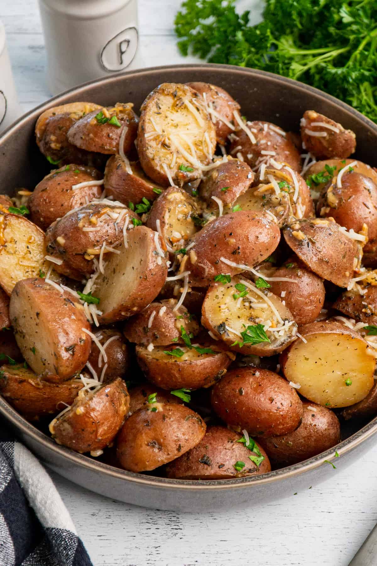 Overhead look at Crock Pot ranch potatoes in a bowl with fresh parsley sprinkled over it.