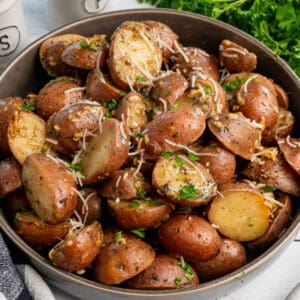 Overhead look at Crock Pot ranch potatoes in a bowl with fresh parsley sprinkled over it.