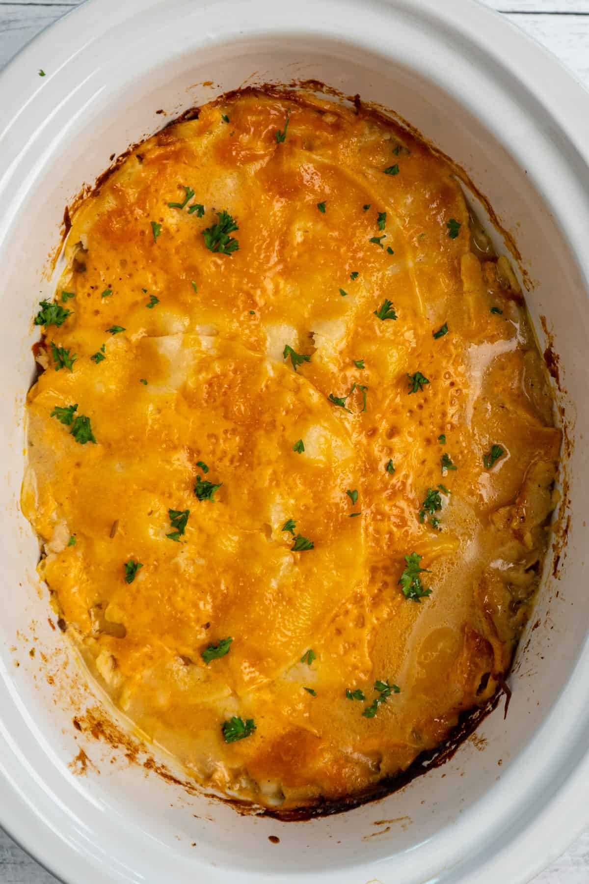 King ranch chicken in a white Crock Pot.