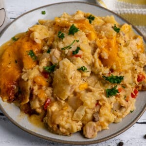 Overhead look at slow cooker king ranch chicken on a gray plate.
