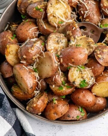 Overhead look at Crock Pot ranch potatoes in a bowl with a spoon in it.