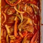 Close up of crock pot sausage and peppers that have been cooked in a slow cooker.