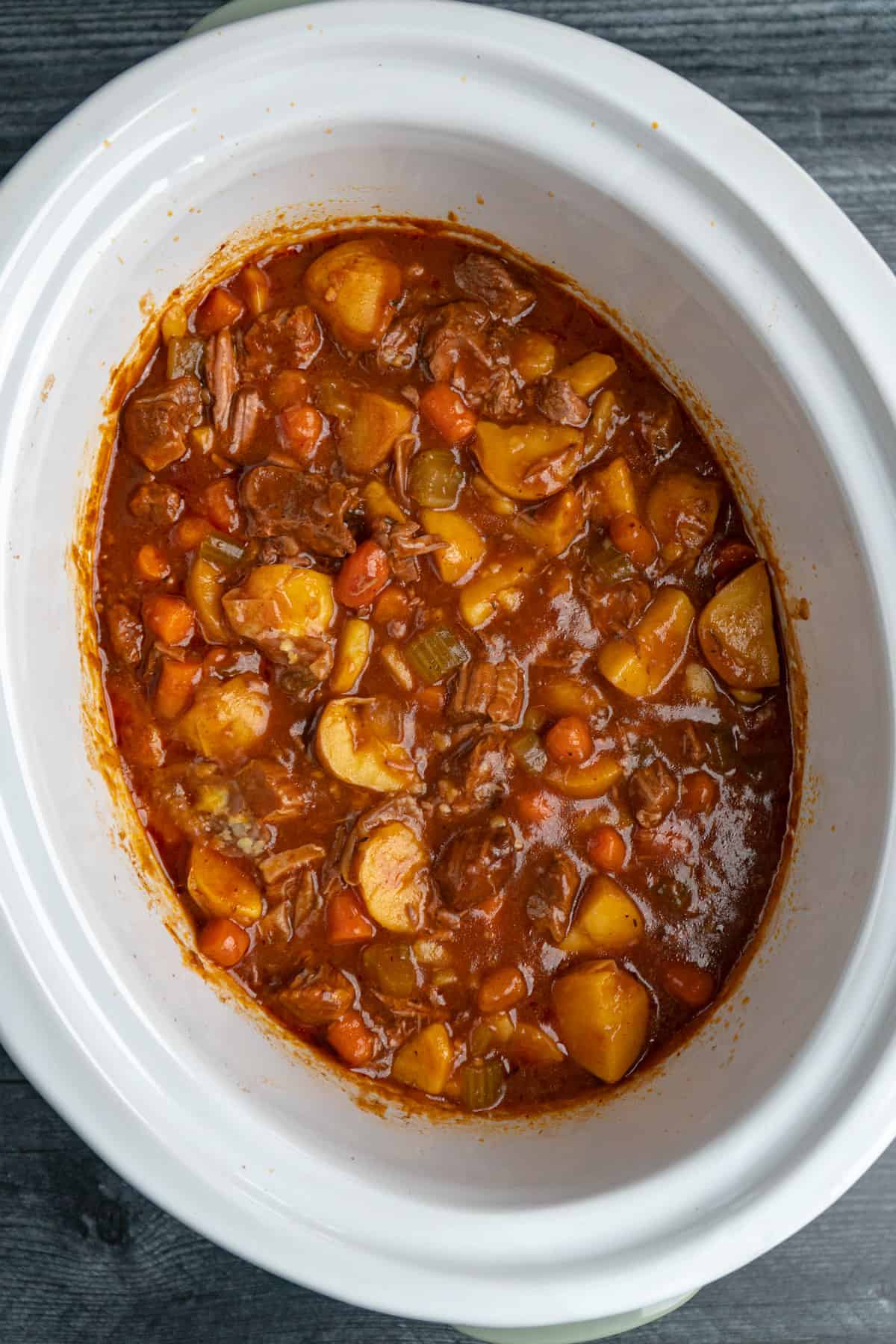 Beef stew in a white slow cooker
