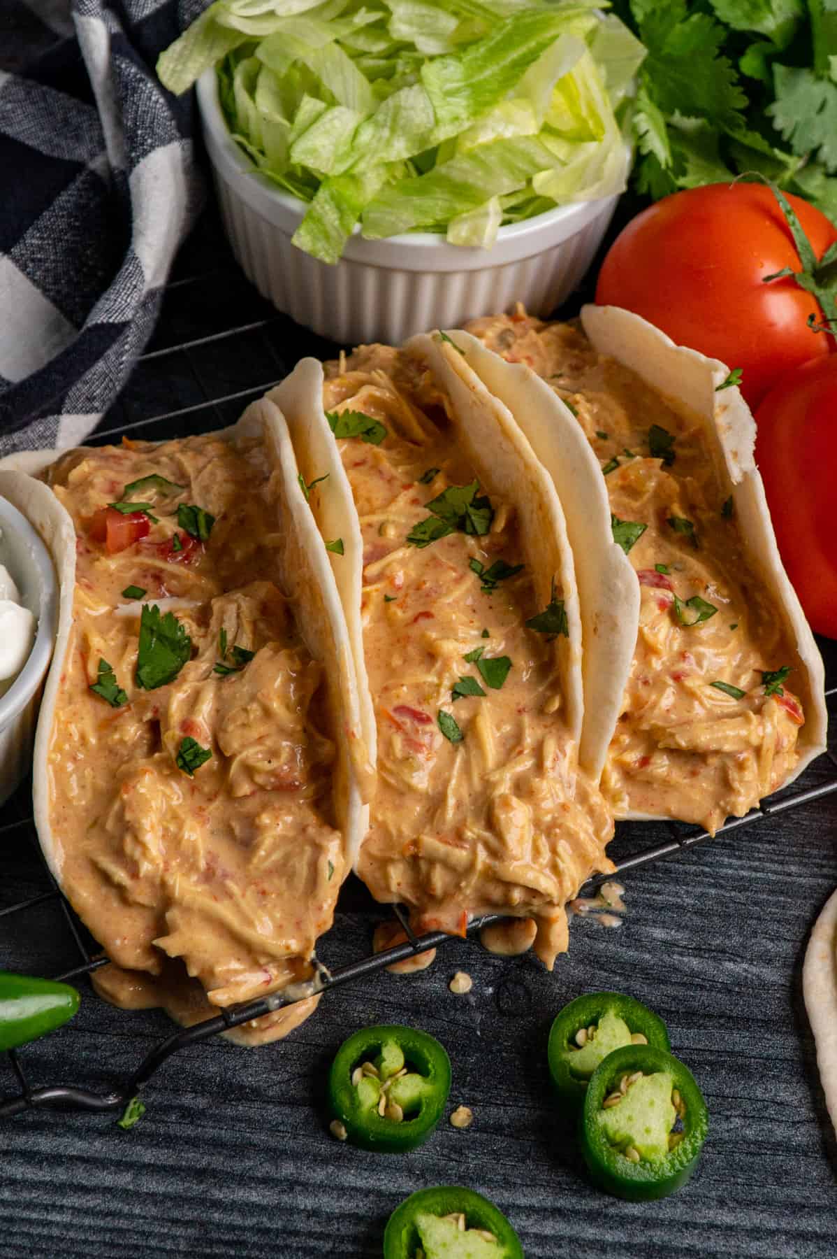 Slow cooker queso chicken tacos on a wire cooling rack