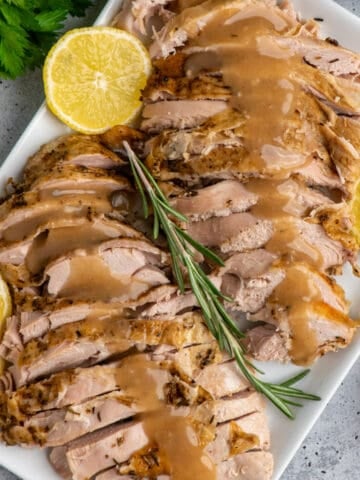 Close up of sliced slow cooker turkey breast on a plate