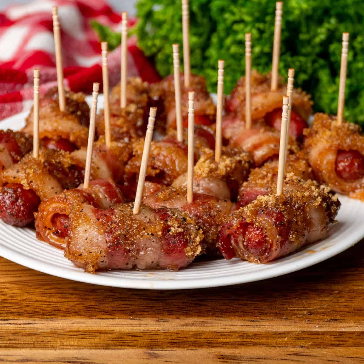 Crock Pot bacon wrapped little smokies on a white plate.