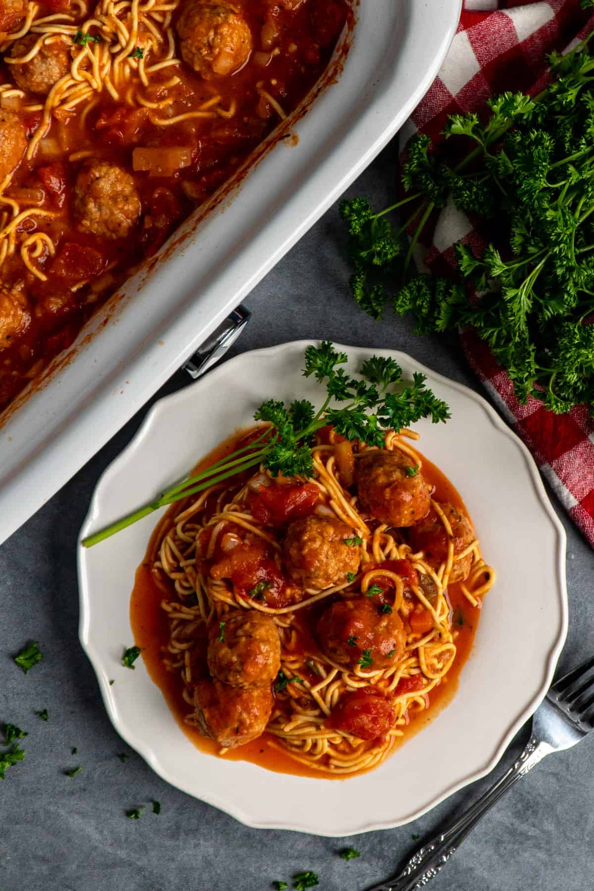 Spaghetti and meatballs on a plate.