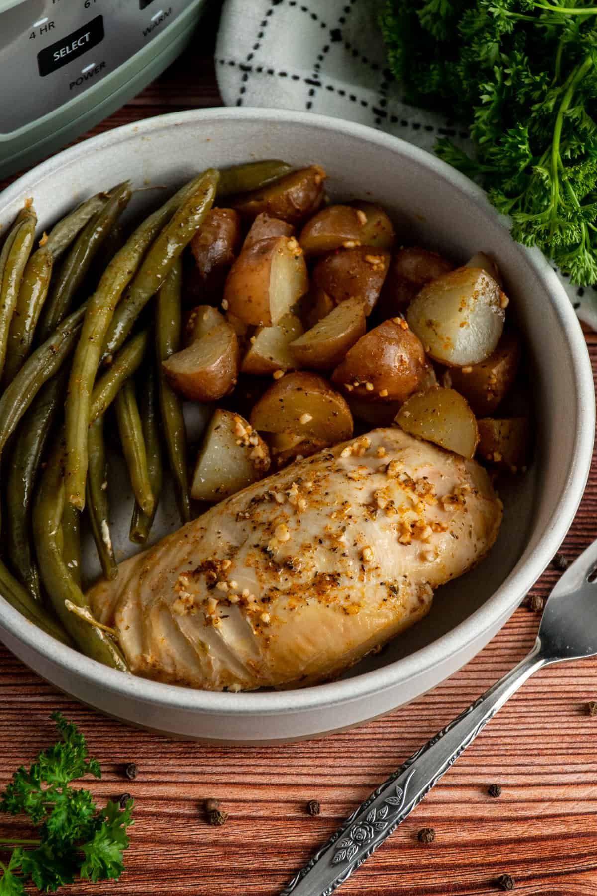 Crock Pot chicken, potatoes and green beans in a bowl.