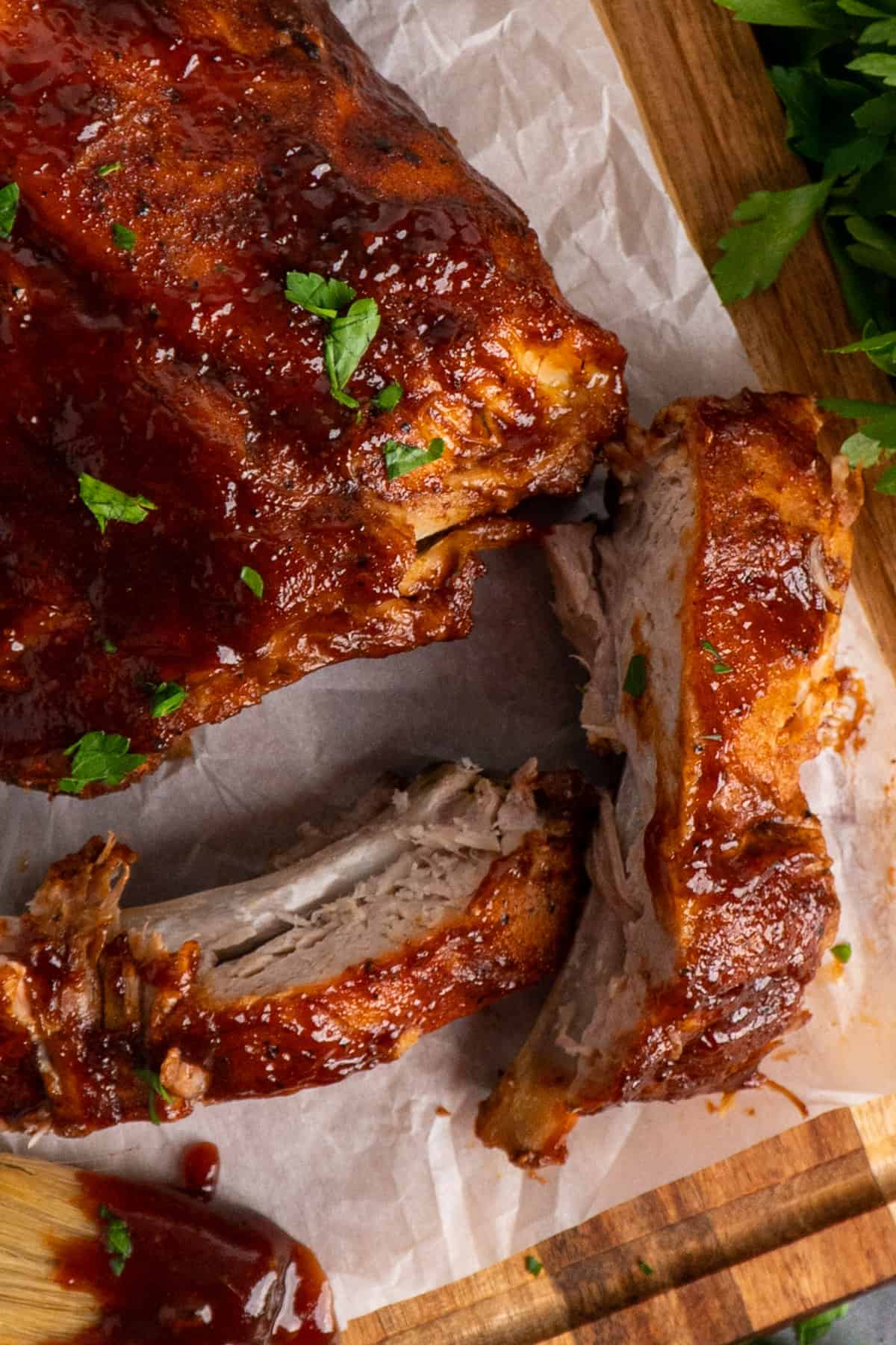 Close up of ribs on a cutting board.