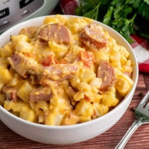 Close-up of Slow cooker sausage and potato casserole in a bowl.