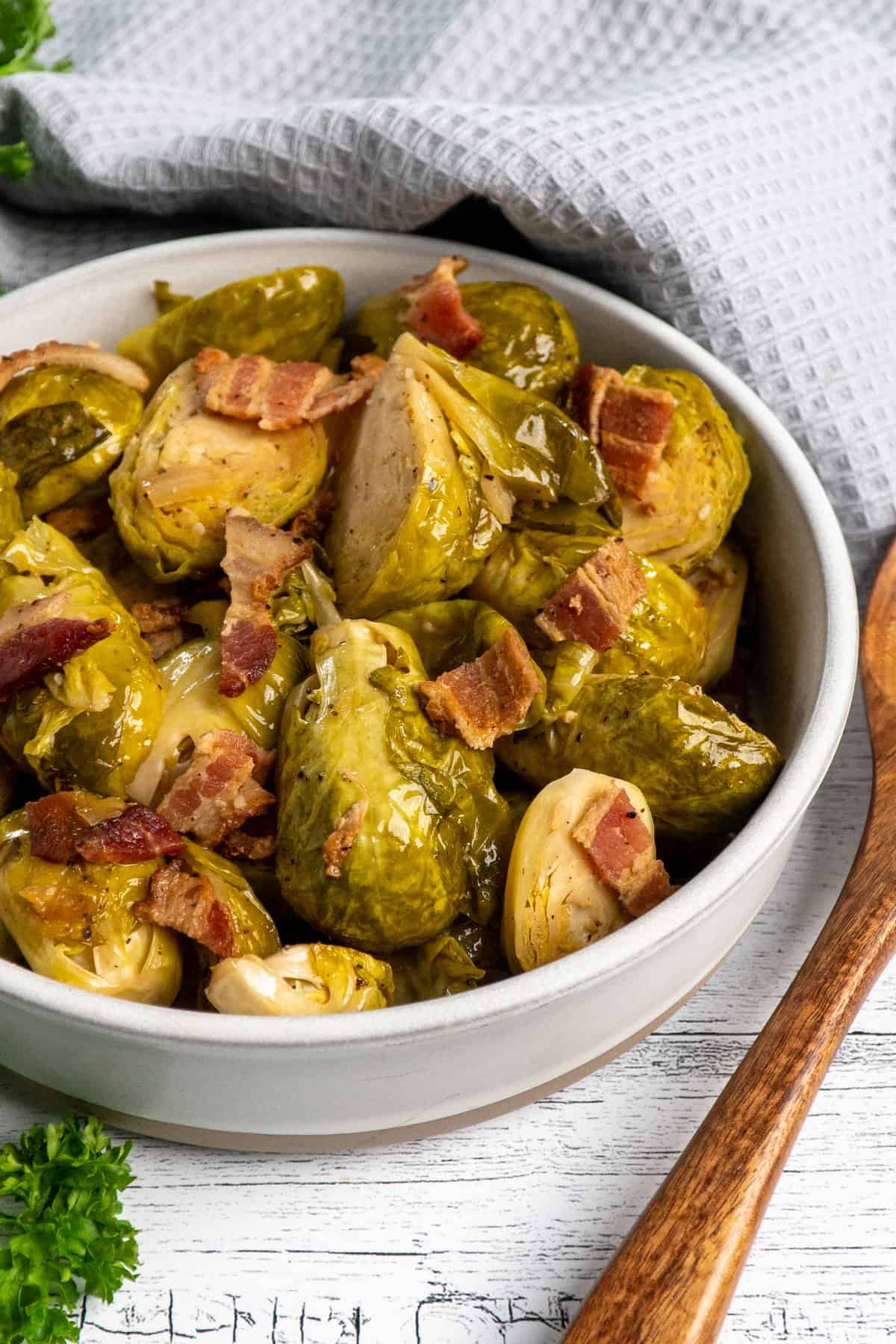 Close-up of Crock Pot brussel sprouts with bacon in a bowl.