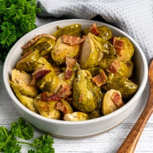 Close-up of Crock Pot brussel sprouts with bacon in a bowl.