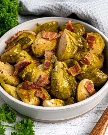 Close-up of Crock Pot brussel sprouts with bacon in a bowl.