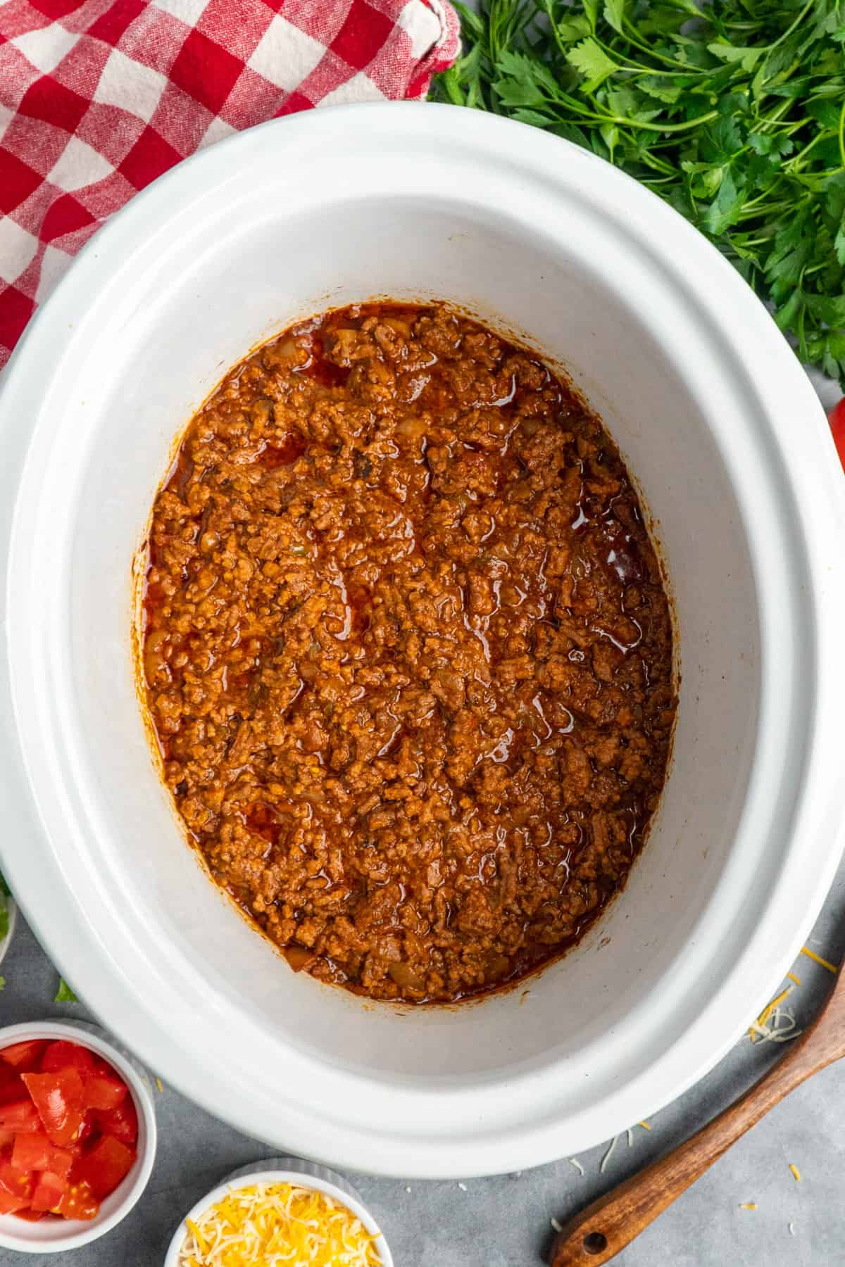 Overhead image of taco meat in a slow cooker.