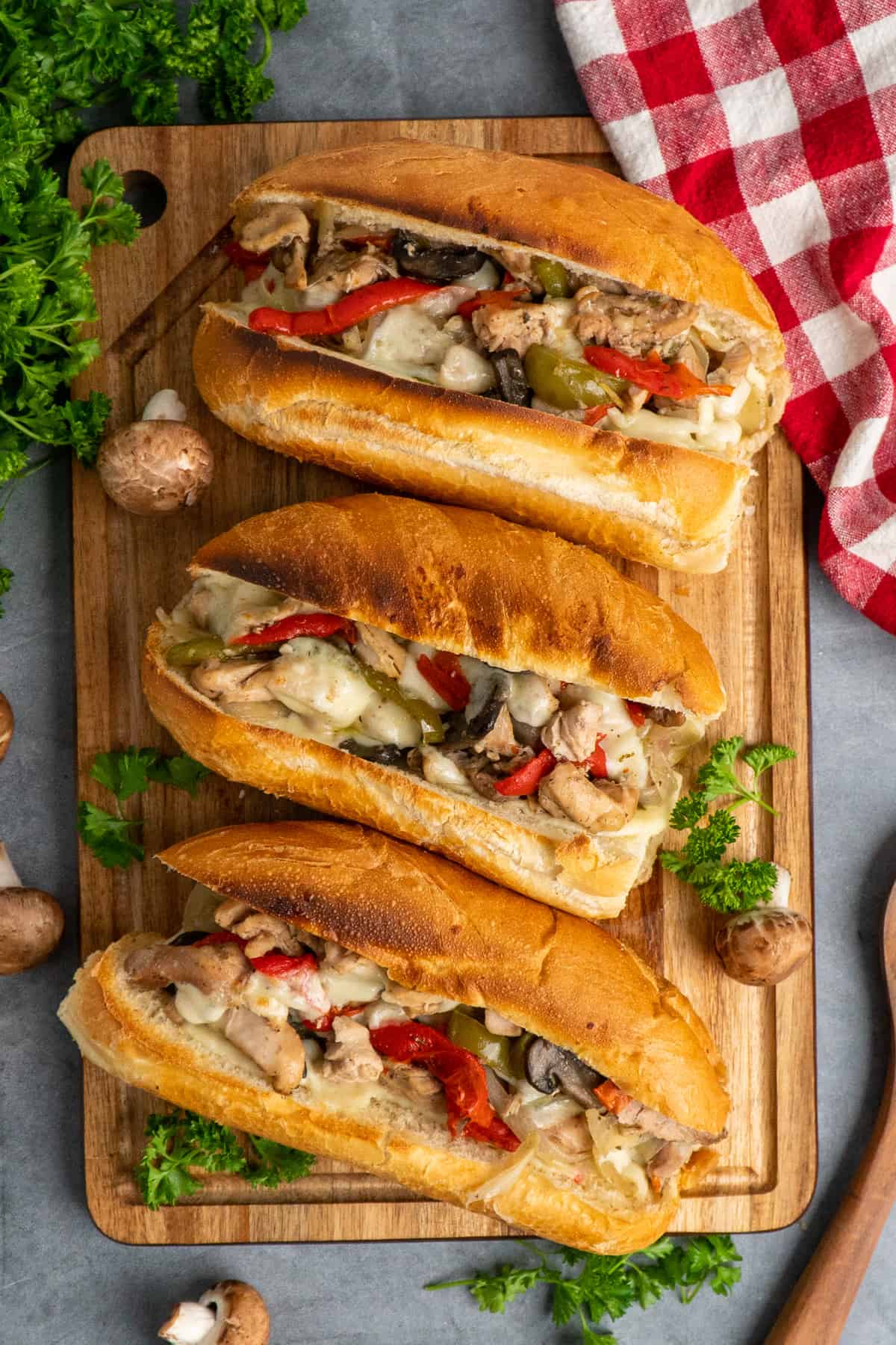 Chicken Philley Cheesesteak on a wood cutting board.