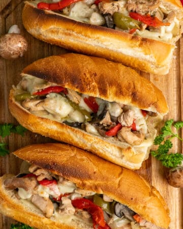 Chicken Philley Cheesesteak on a wood cutting board.