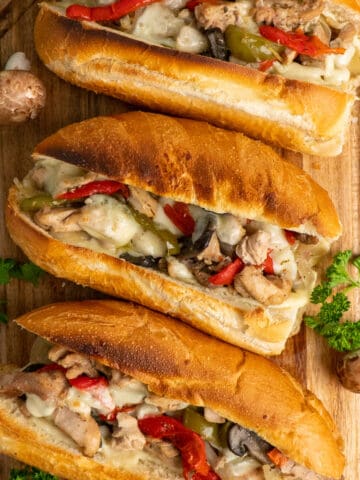 Chicken Philley Cheesesteak on a wood cutting board.