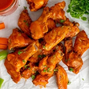 Crock Pot chicken wings on a piece of parchment paper.