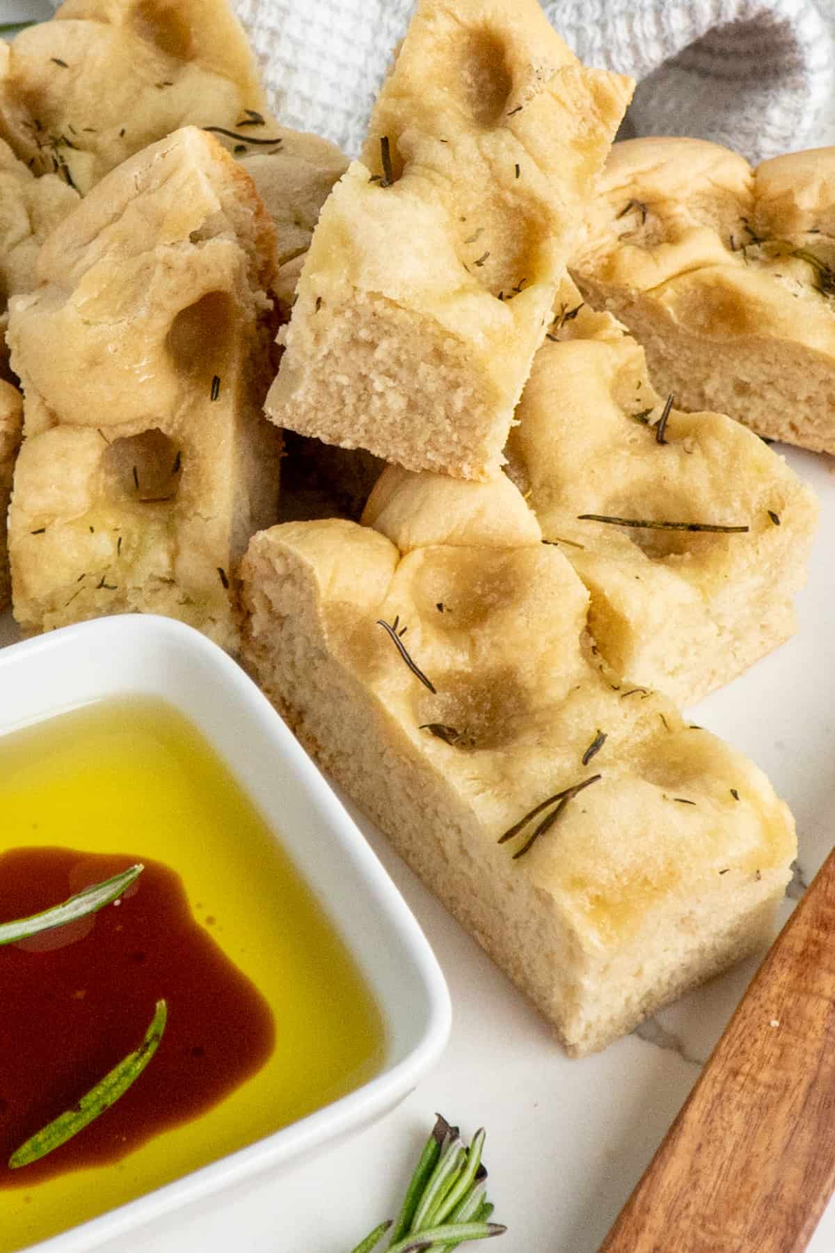Foccacia bread stacked on top of each other.