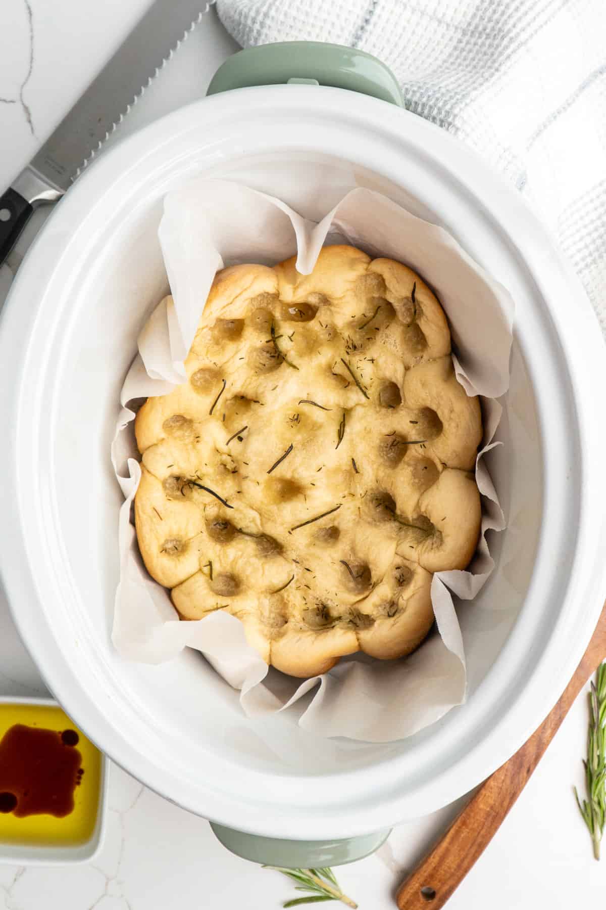 Overhead look a foccacia bread in a slow cooker.