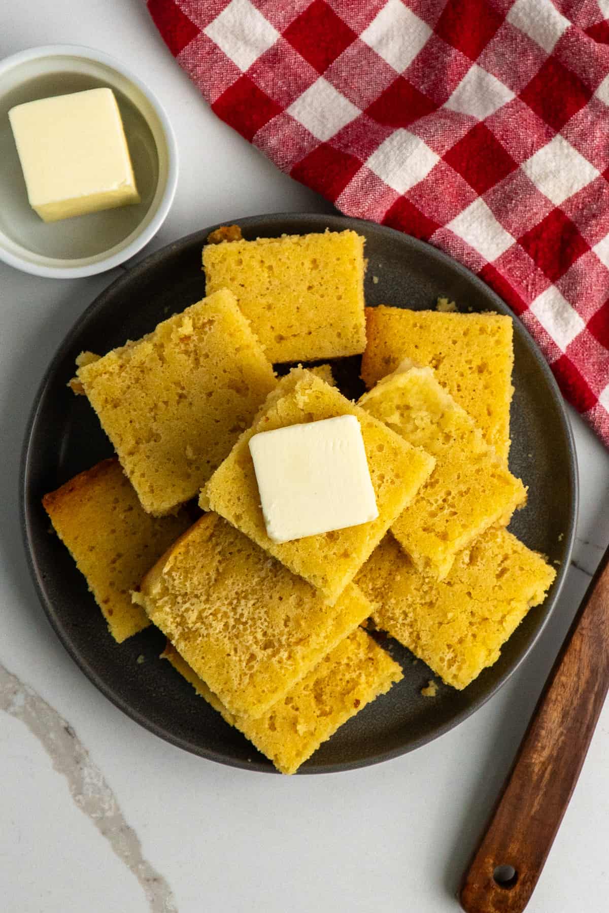 Overhead look at cornbread on a plate.