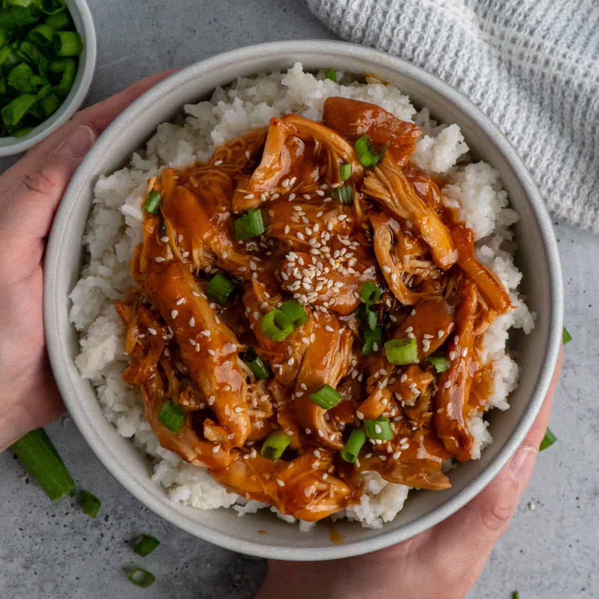 Huli Huli chicken over a bowl of rice.