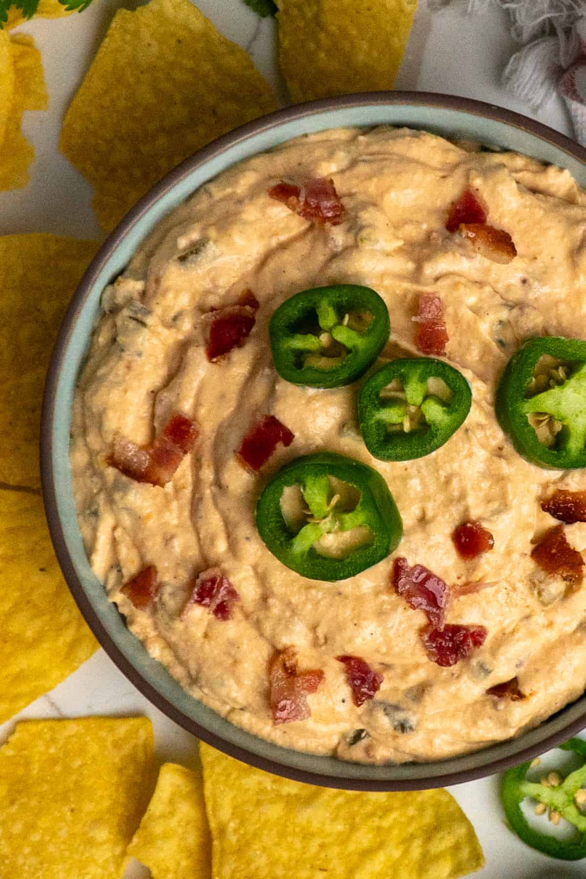 Overhead, look at jalapeno popper dip in a bowl.