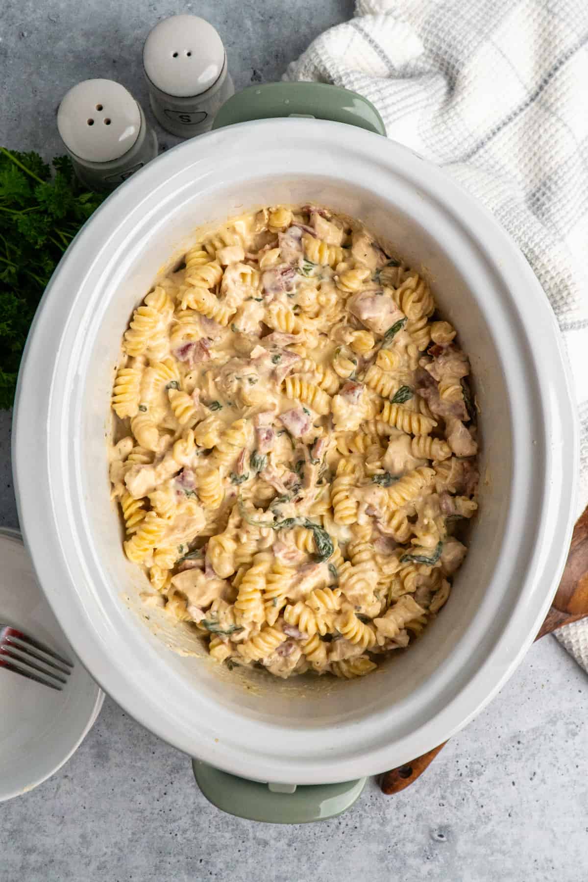 Overhead look at chicken bacon ranch pasta in a slow cooker.