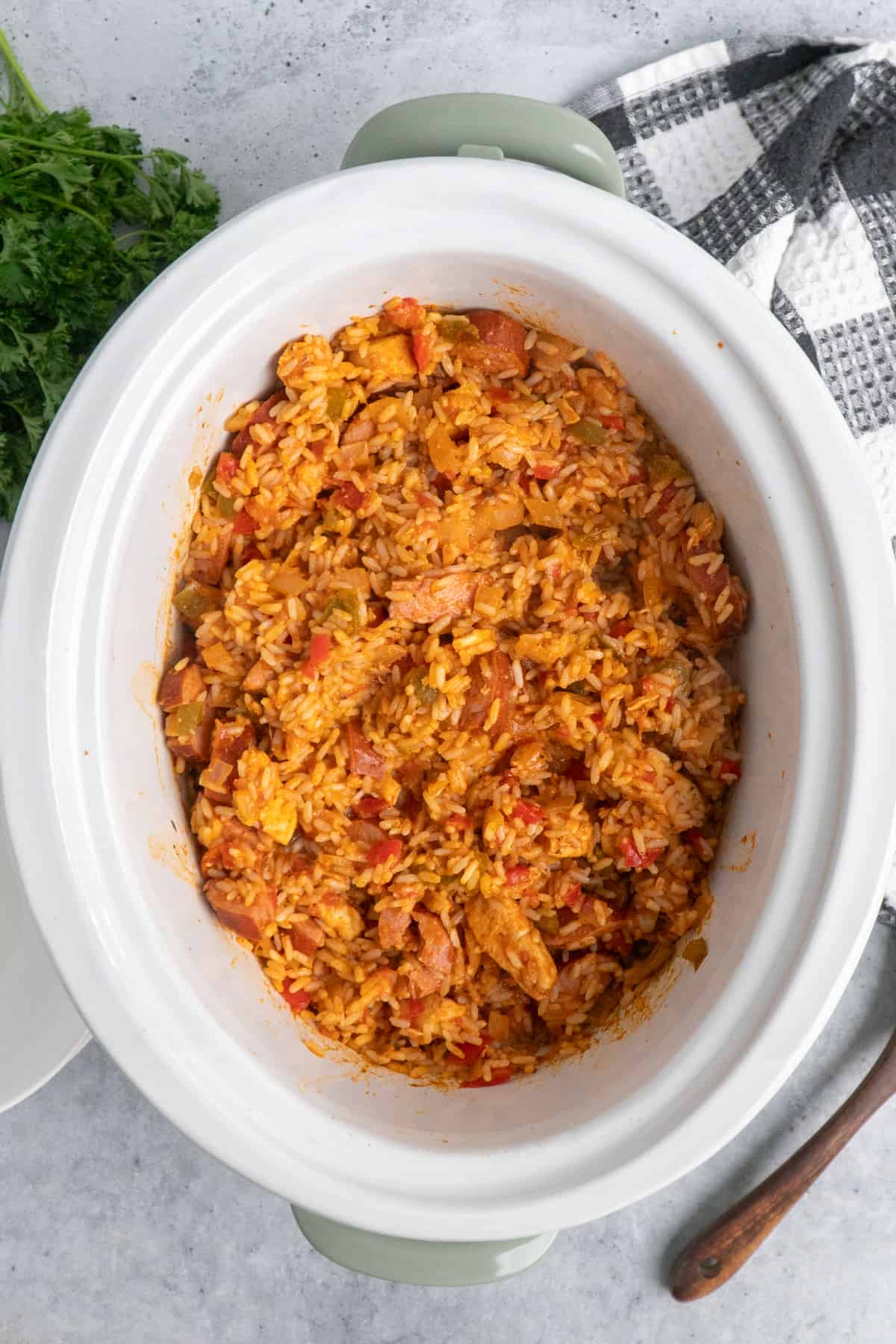 Overhead look at jambalaya in a slow cooker.