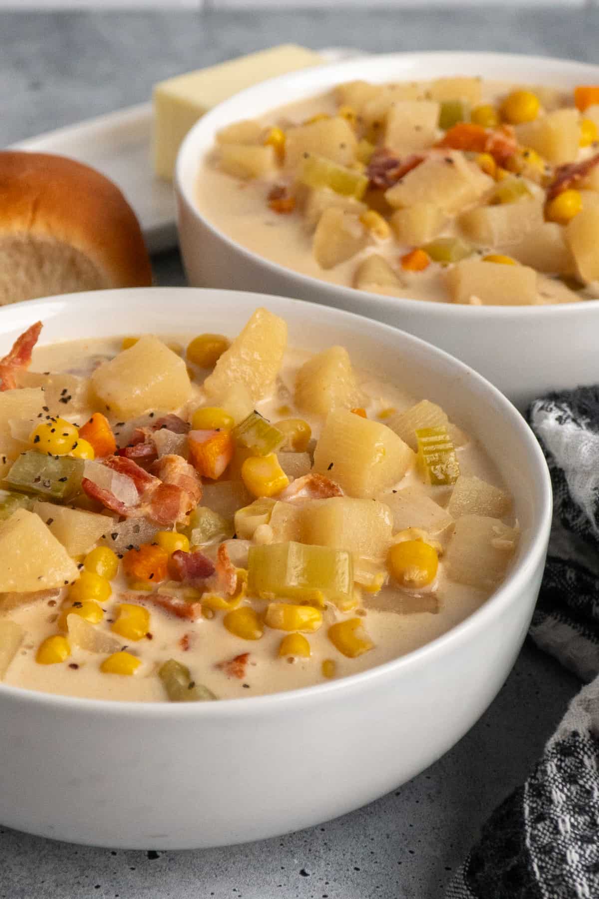 Close-up of a white bowl of slow cooker corn chowder.