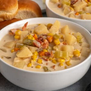 Close-up of a white bowl of slow cooker corn chowder.
