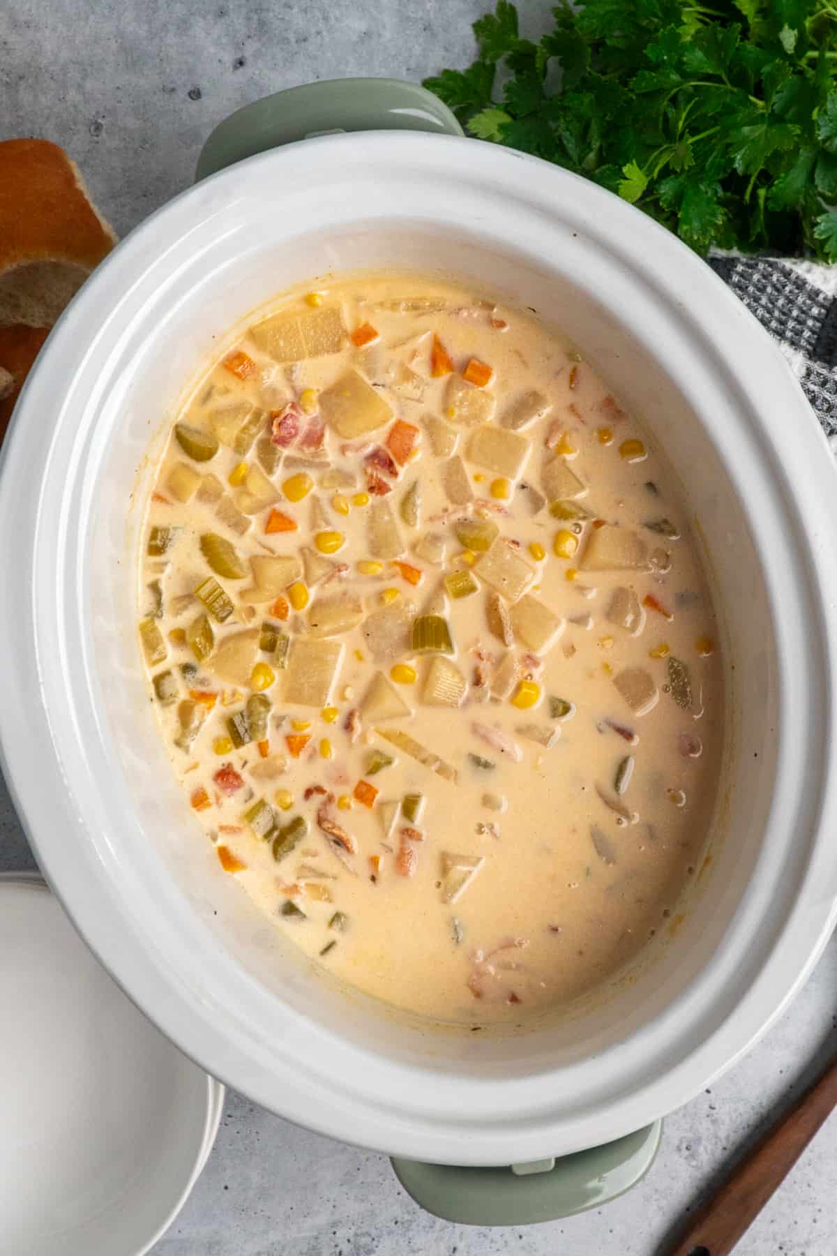 Overhead look at corn chowder in a crock pot.