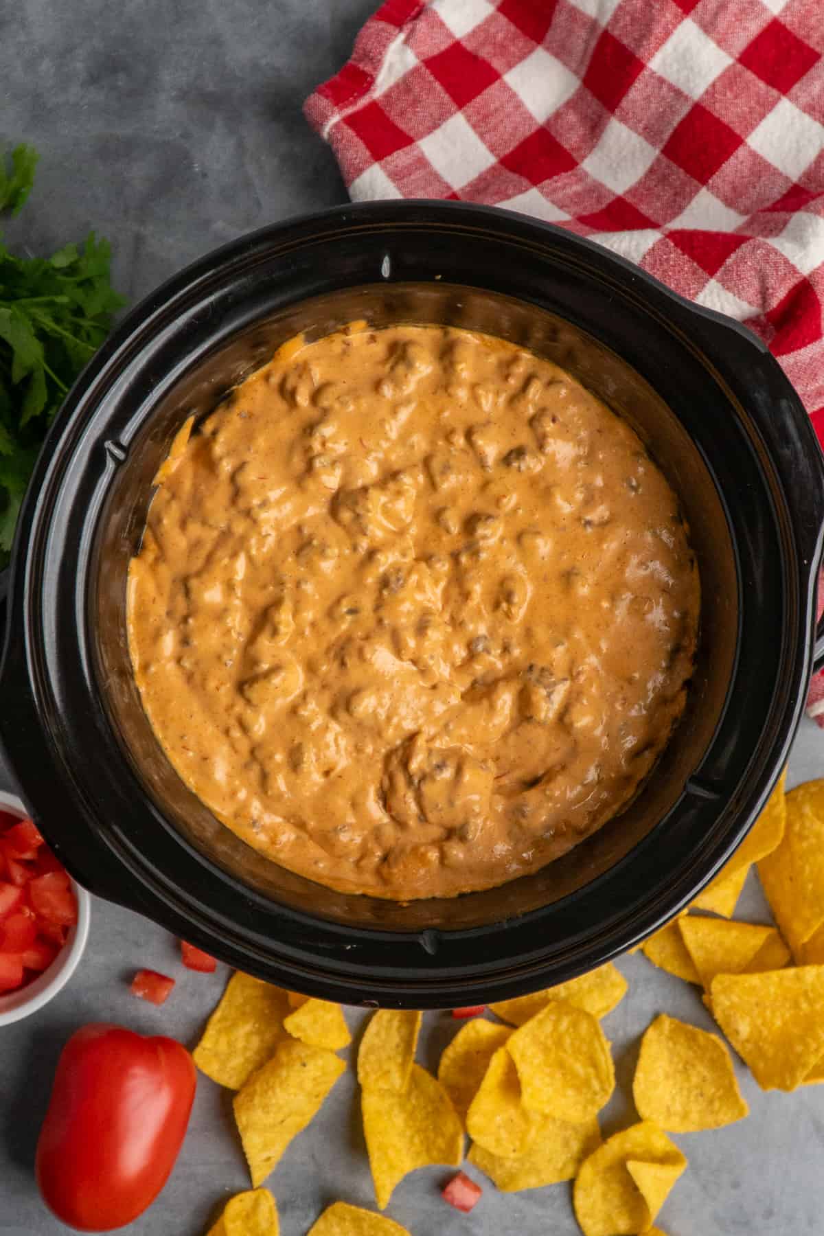 Overhead, look at taco dip in a crock pot.