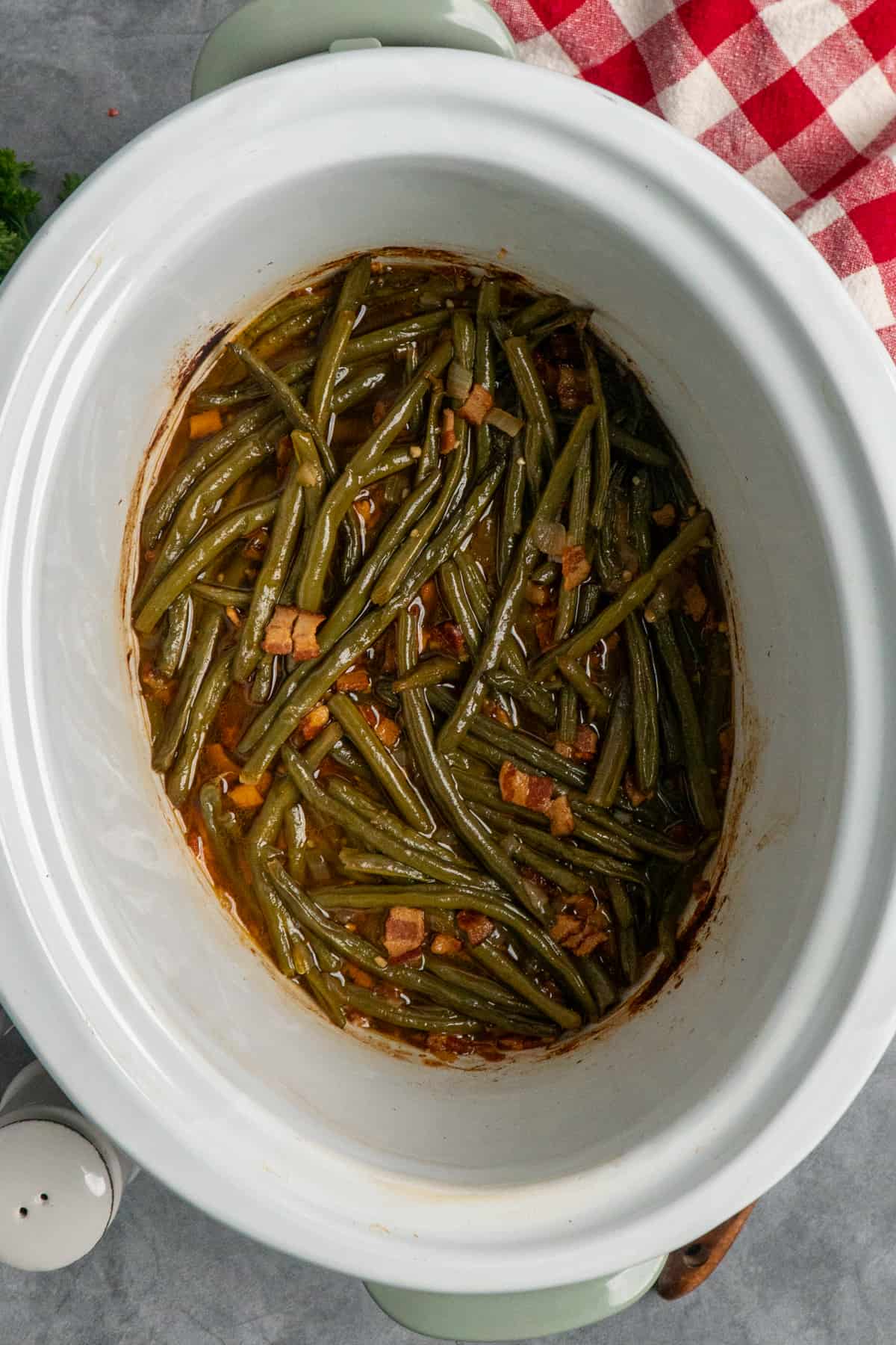 Overhead look at green beans in a crock pot.