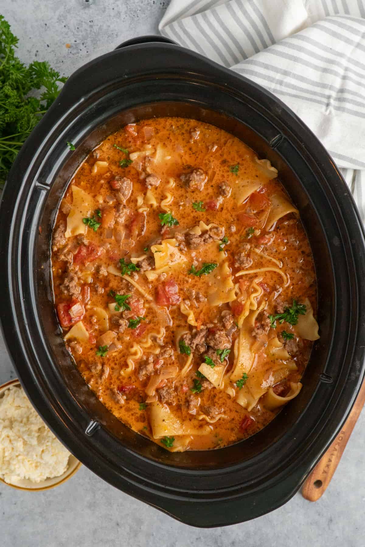 Overhead look at lasagna soup in a slow cooker.