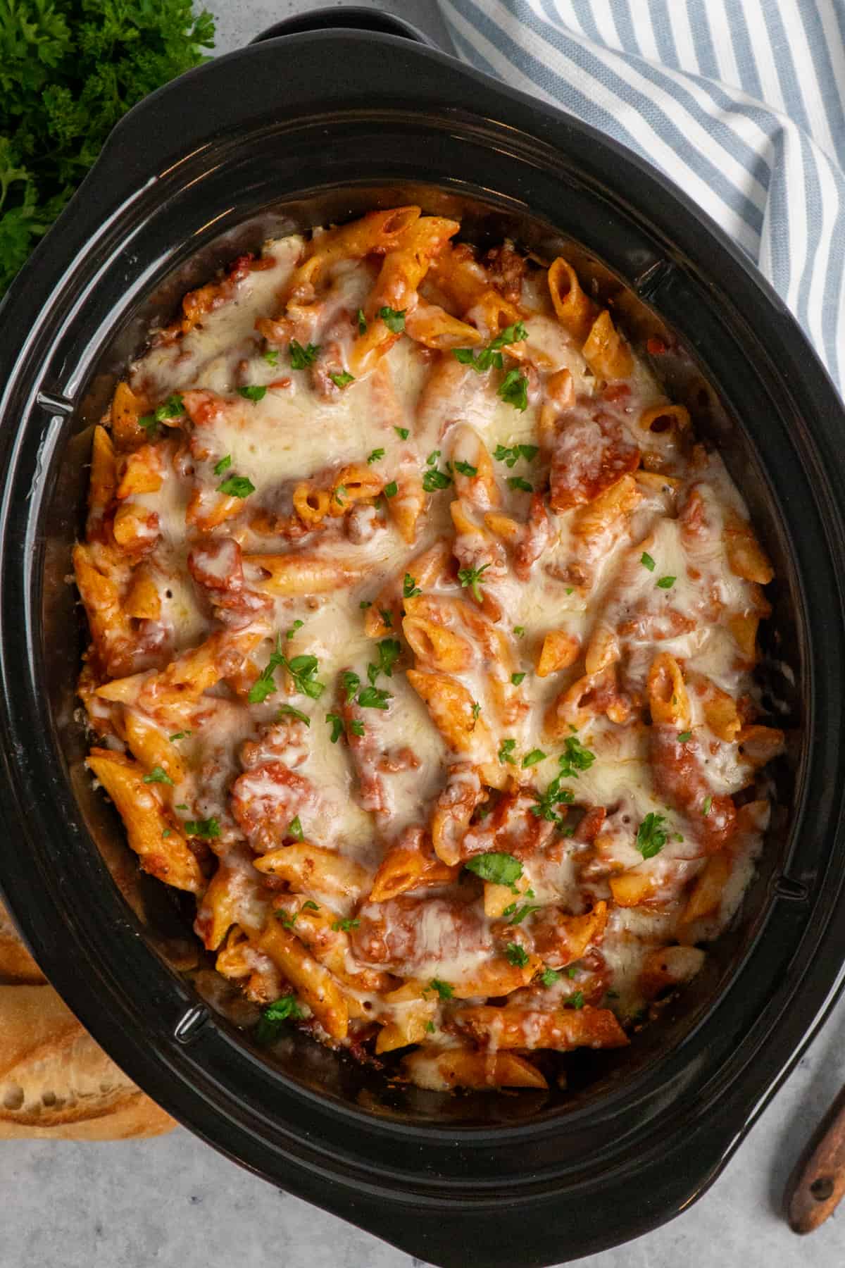 Overhead look at pizza casserole in a slow cooker.