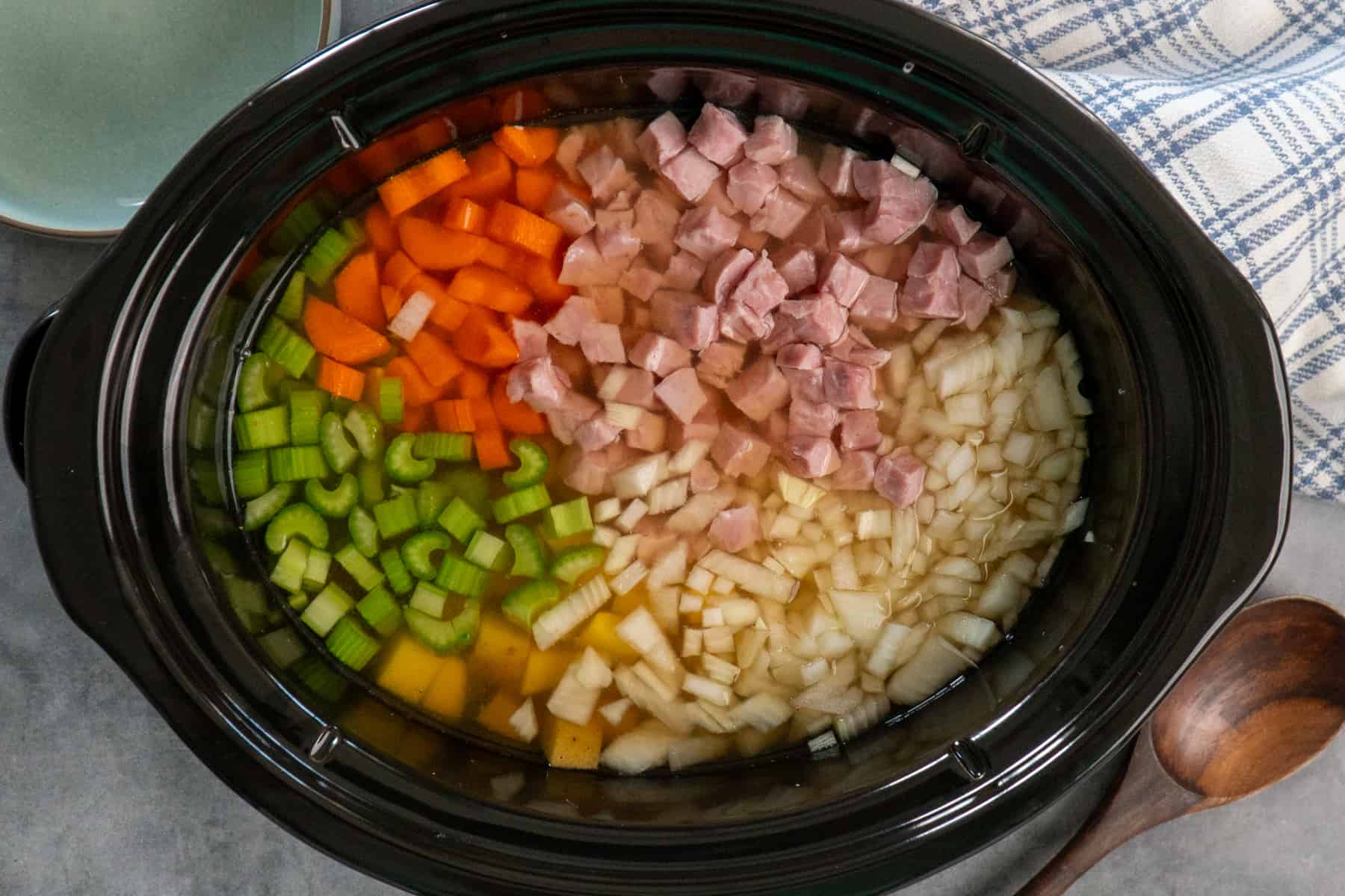 Ham, potatoes and veggies in a crock pot.