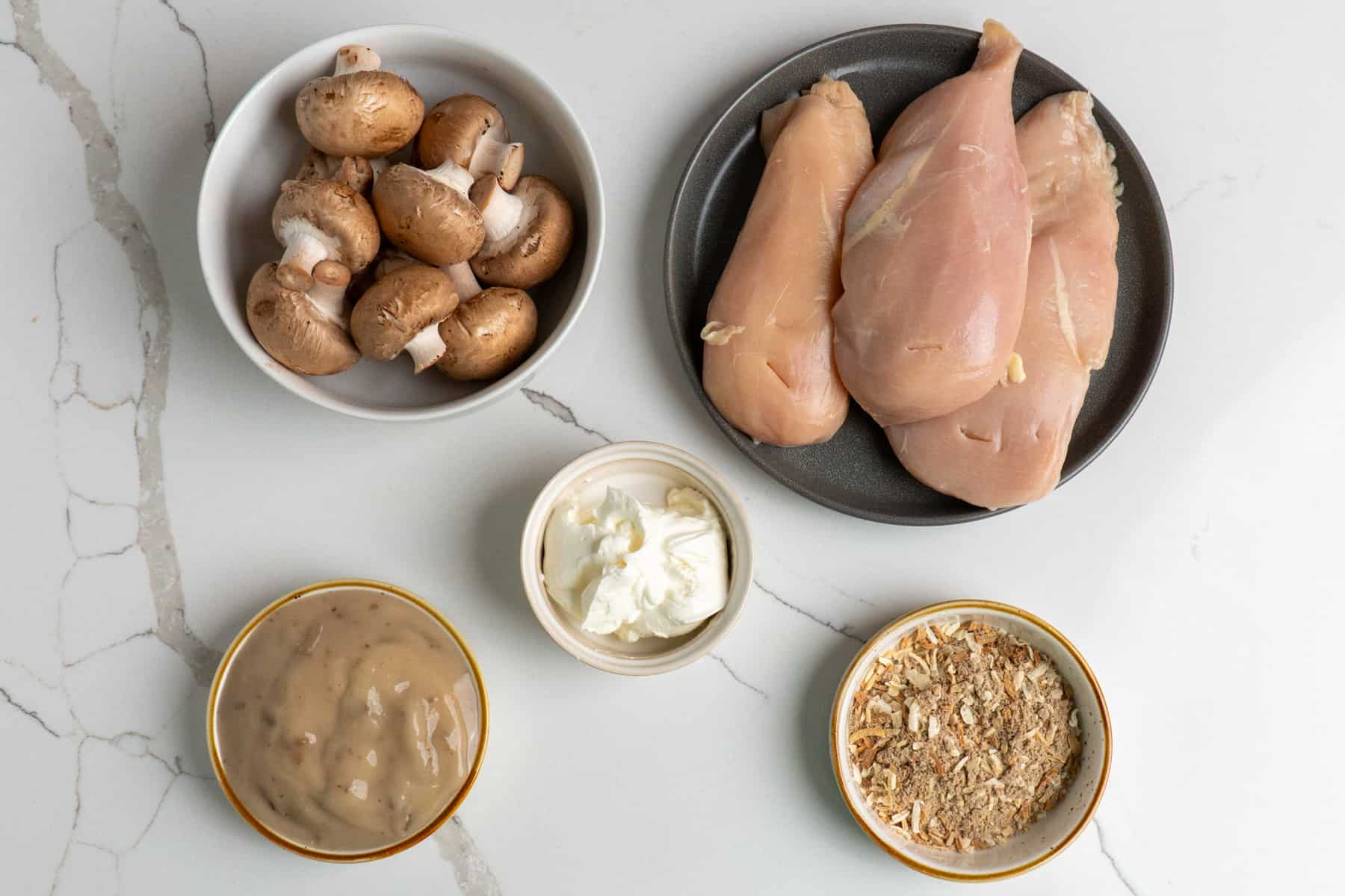 All the ingredients to make mushroom chicken.