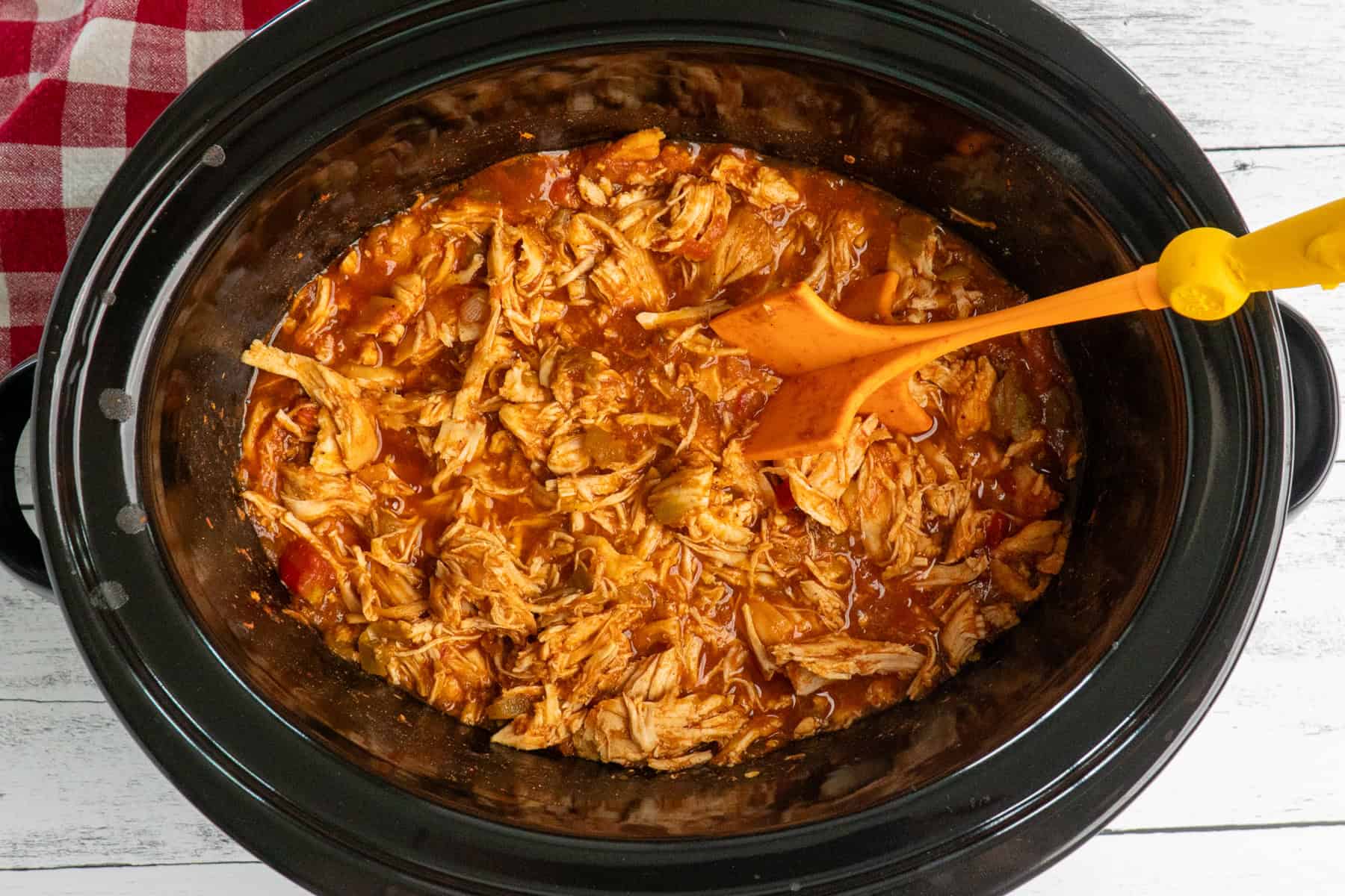 Mexican shredded chicken in a crock pot.