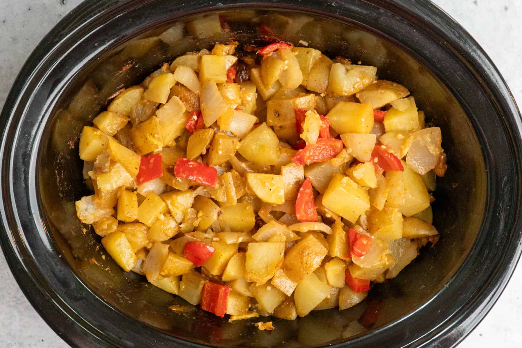 Cooked breakfast potatoes in a slow cooker.
