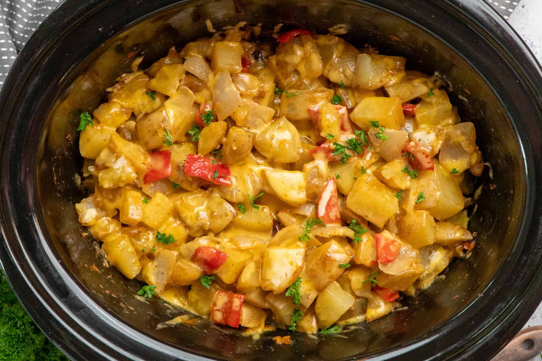 Breakfast potatoes in a crock pot ready to be served.