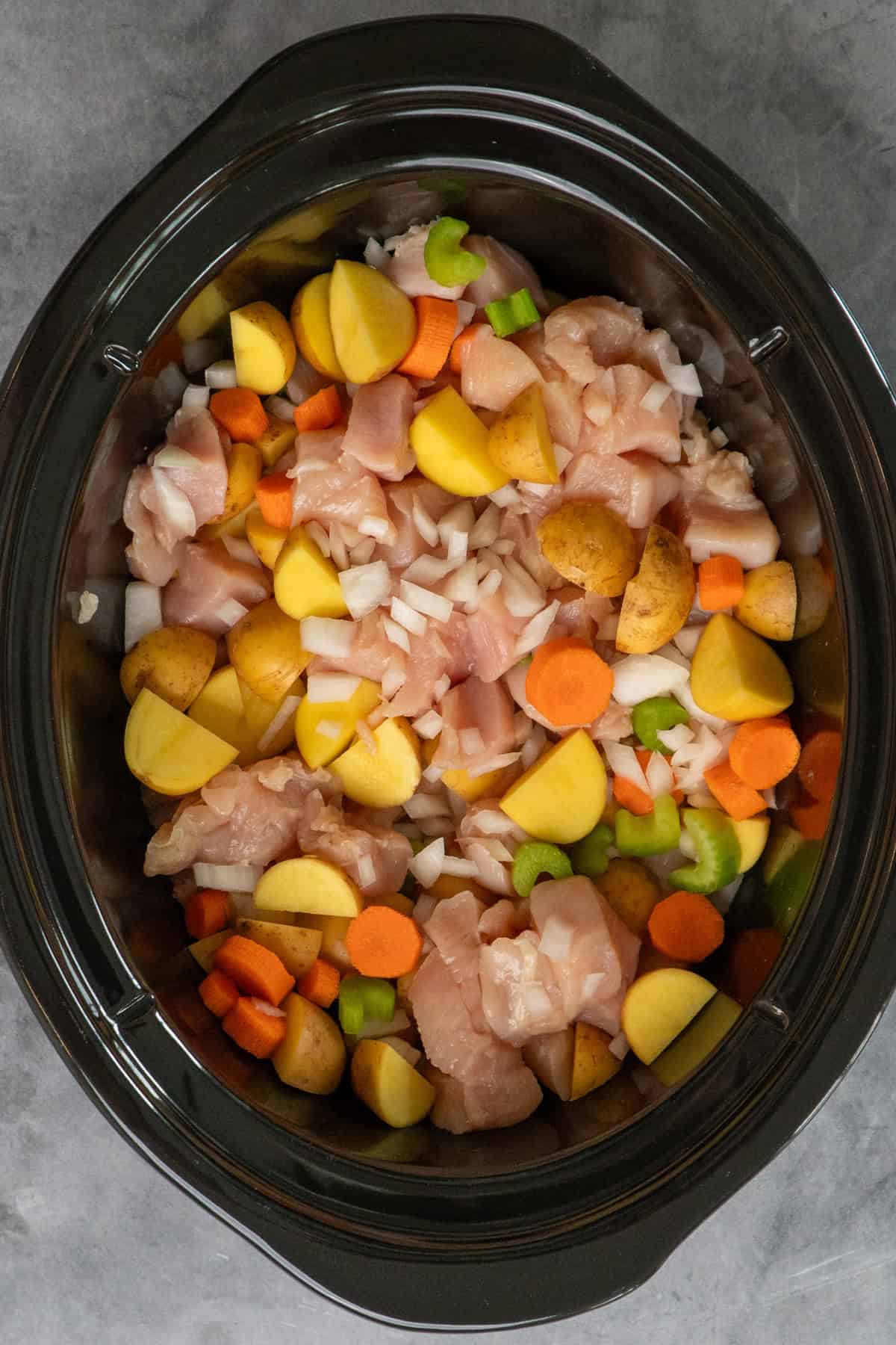 Chicken and veggies in the slow cooker.