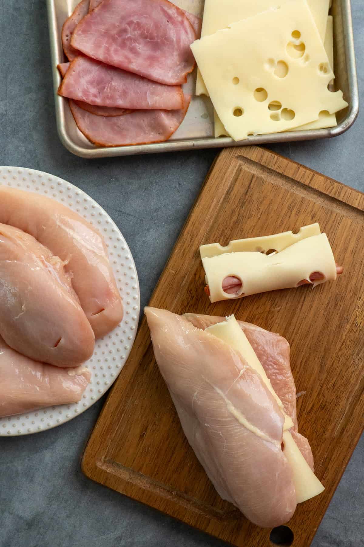 Chicken breasts sliced with rolled up ham and cheese inside.