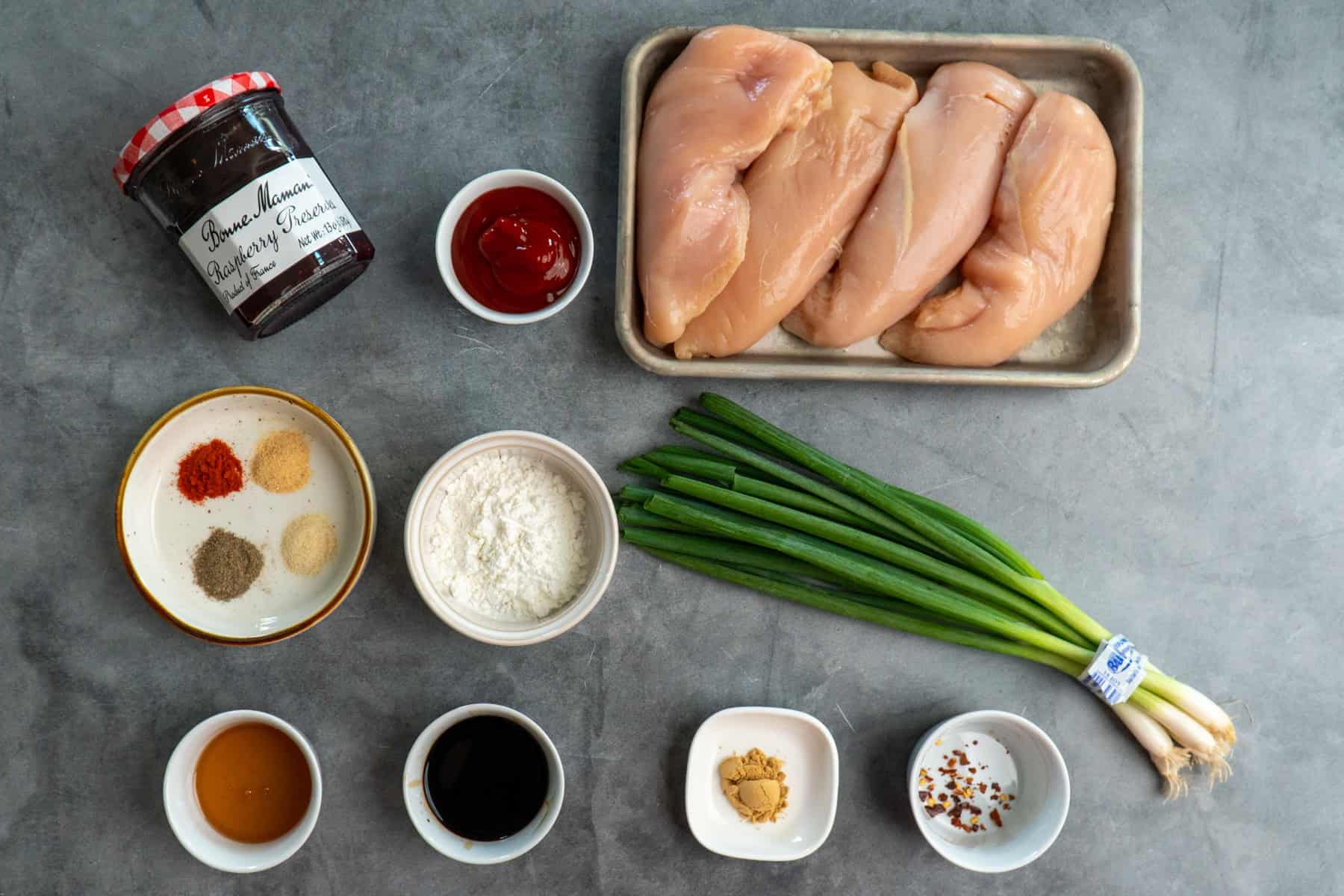 Ingredients to make raspberry chicken on the table before preparing.