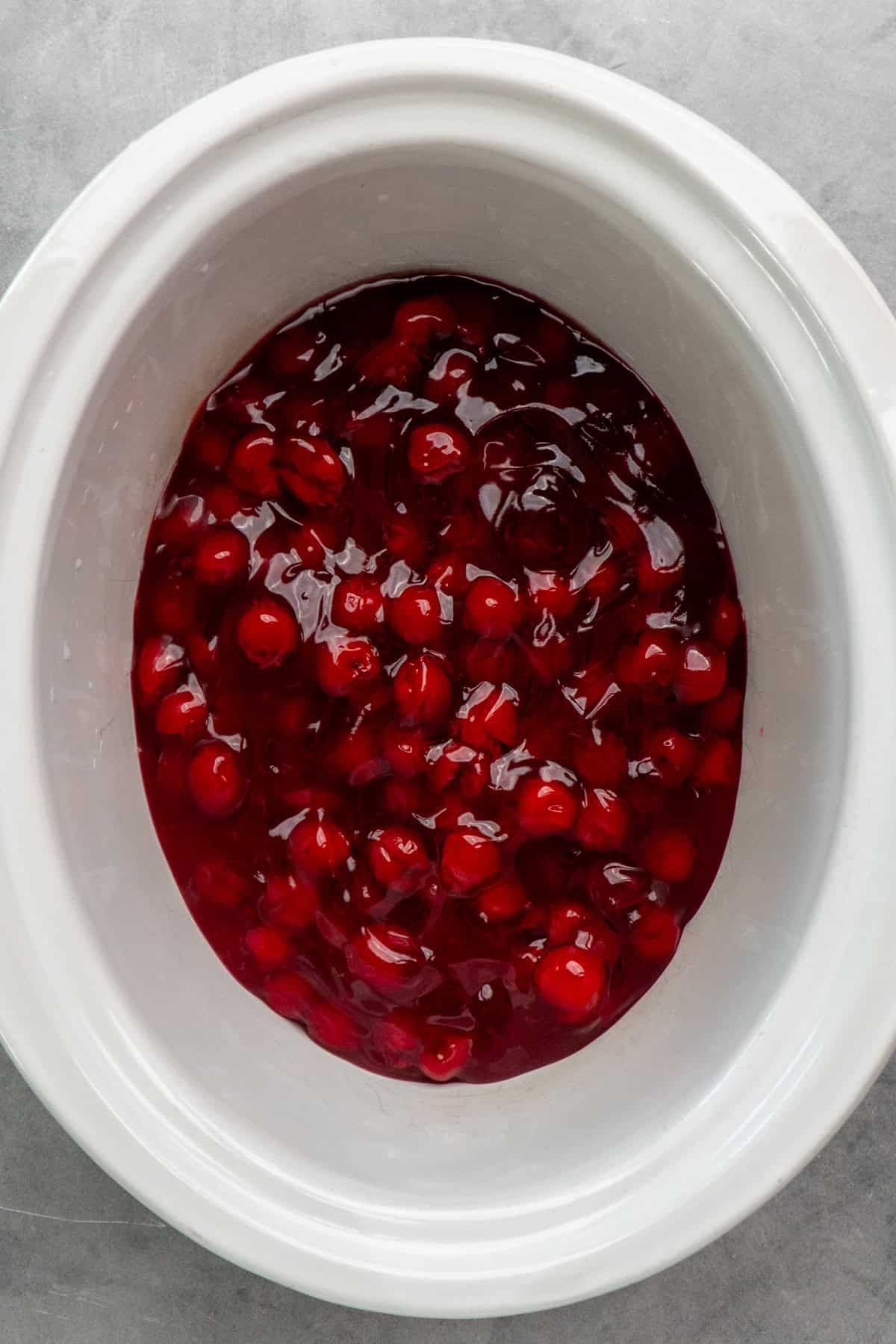 Cherry pie filling in a slow cooker.