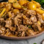 Crock Pot garlic butter steak bites on a plate ready to be eaten.