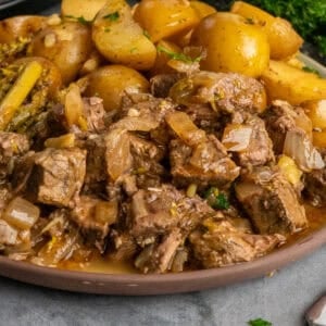 Crock Pot garlic butter steak bites on a plate ready to be eaten.